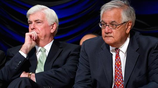 Then-Sen. Chris Dodd (L) and then-Rep. Barney Frank at the signing of the Dodd-Frank act in 2010.
