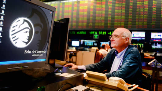 A trader works on the floor of the Buenos Aires Stock Exchange.