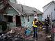 Federal inspectors check a home destroyed by Hurricane Sandy on Staten Island, N.Y., Nov. 28, 2012.