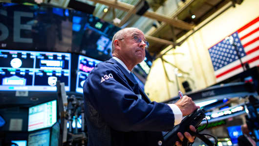 A trader works on the floor of the New York Stock Exchange.