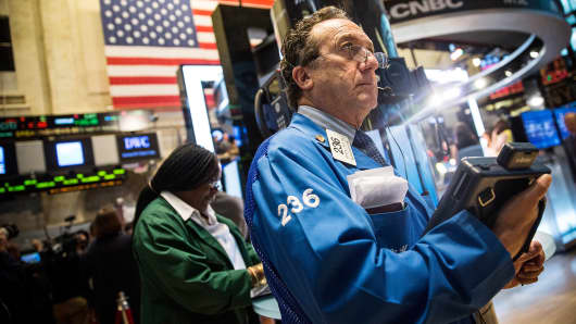 A trader works on the floor of the New York Stock Exchange in New York.
