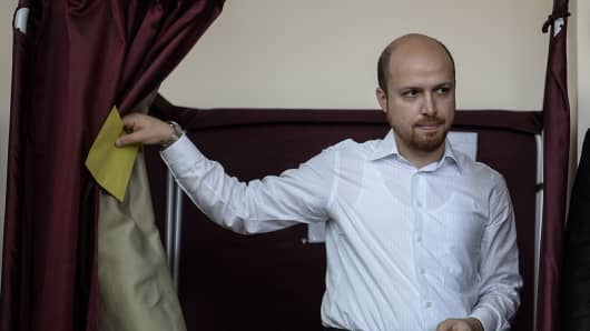 Bilal Erdogan casts his vote in a presidential election at a polling station in Istanbul on August 10, 2014.