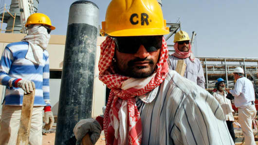 Oil workers at an oil facility near Riyadh, Saudi Arabia.
