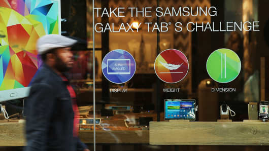 People walk by a Samsung store in lower Manhattan in New York City.