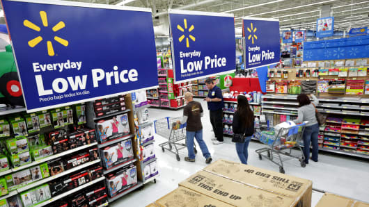 Residents shop at Walmart as the store prepares for Black Friday in Los Angeles, Calif., November 24, 2014.