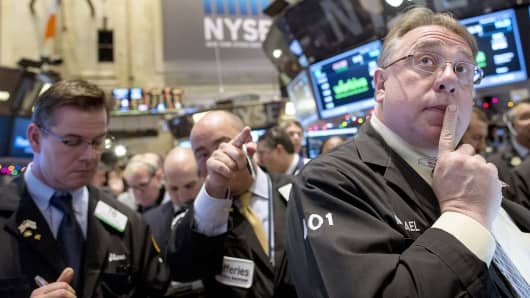 Traders work on the floor of the New York Stock Exchange Dec. 12, 2014.