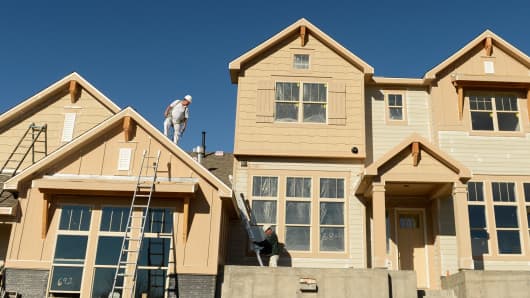 Construction crews work on new town homes in Erie, Colorado.
