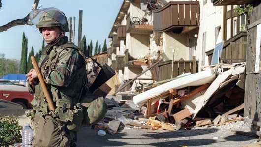 A National Guard soldier stands on a street after an earthquake in Northridge, Calif., Jan. 18, 1994.
