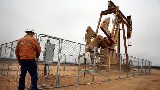 An oil well owned an operated by Apache Corporation in the Permian Basin is shown in Garden City, Texas, Feb. 5, 2015.