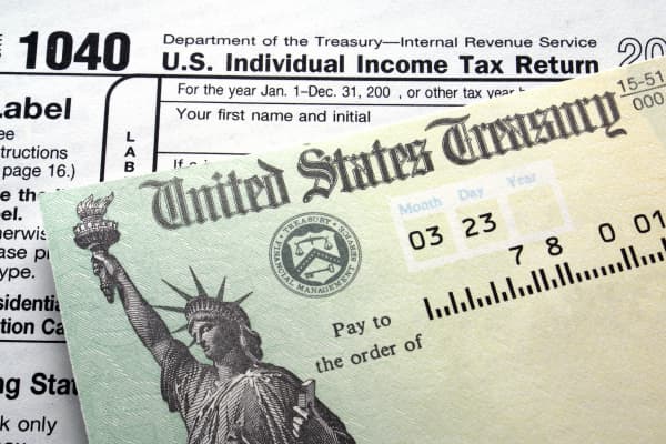 Treasury check and 1040 tax form