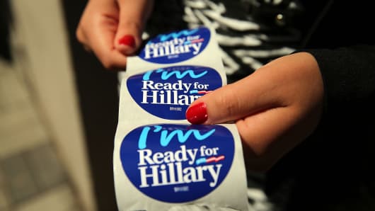 Stickers are handed out to supporters of Hillary Clinton at a rally in Manhattan on April 11, 2015, in New York City.