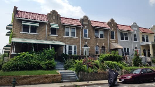 The end unit is a foreclosed, vacant home in Washington, DC's Petworth neighborhood.  RealtyTrac estimates its value at $600,117.