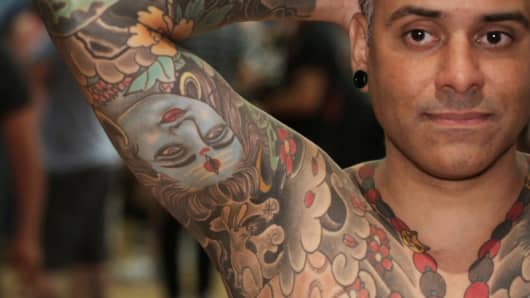 Tattoo model Jesus Ayala shows off his tattoos at the NYC Tattoo Convention in June.