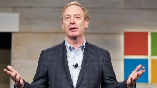 Microsoft General Counsel and Executive Vice President Brad Smith addresses shareholder during Microsoft Shareholders Meeting December 3, 2014 in Bellevue, Washington.