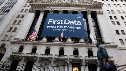 A banner for First Data Corp. adorns the facade of the New York Stock Exchange, to mark the company's IPO, Thursday, Oct. 15, 2015.