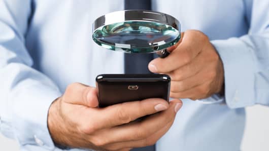 Searching mobile phone magnifying glass