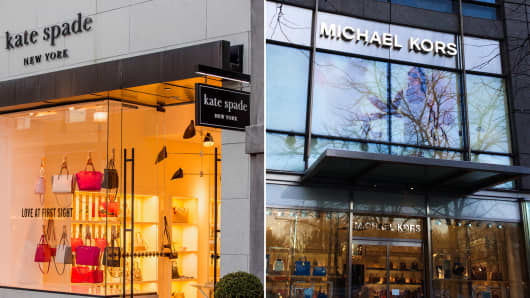 Kate Spade and Michael Kors storefronts.