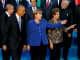 President Barack Obama (L-R) departs with Germany's Chancellor Angela Merkel and Brazil's President Dilma Rousseff after participating in a family photo with fellow world leaders at the start of the G20 summit at the Regnum Carya Resort in Antalya, Turkey, November 15, 2015.