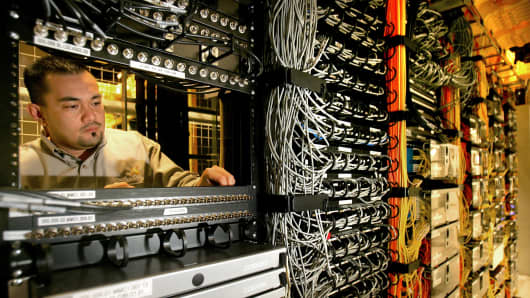 immie Profeta Jr., lead technician, services different companies internet servers at Switch and Data PAIX in Palo Alto, California, on Tuesday. Switch and Data PAIX is one of the primary Internet exchange points in North America serving hundreds of businesses servers.