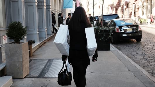 A shopper walks through lower Manhattan in New York City.