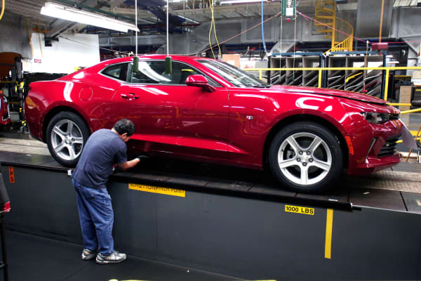 A General Motors worker puts the finishing touches on a new 2016 Chevrolet Camaro at the Lansing Grand River Assembly Plant October 26, 2015 in Lansing, Michigan.