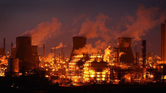 An illuminated Grangemouth Oil Refinery emits smoke on March 29, 2012 in Grangemouth, Scotland.