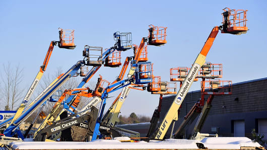 A group of multi-colored lifts at United Rentals.