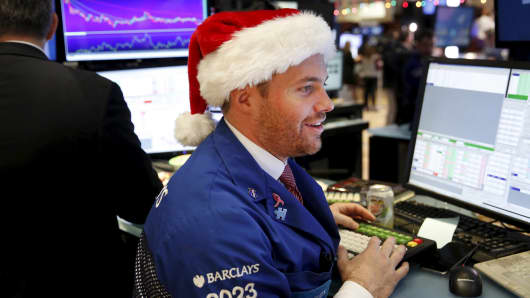 A trader wears a Santa hat as he works on the floor of the New York Stock Exchange the day before Christmas in New York on Dec. 24, 2015.