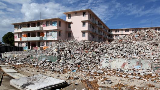 Debris is scattered around the government housing project Puerta de Tierra which is undergoing renovation work, in San Juan, December 2, 2015.