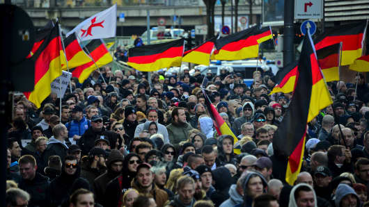 Supporters of right wing groups gather to protest in Cologne on January 9 over Germany's open-door policy for asylum seekers, which resulted in about 1.1 million migrants and refugees entering the country in 2015.