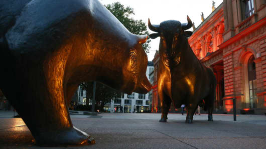 A bull and a bear statue stand outside the Frankfurt Stock Exchange in Frankfurt.