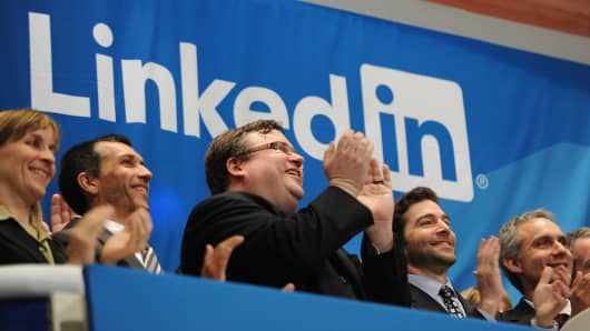 Linkedin founder Reid Garrett Hoffman (C) and CEO Jeff Weiner (2nd R) at the ringing of the opening bell of the New York Stock Exchange May 19, 2011