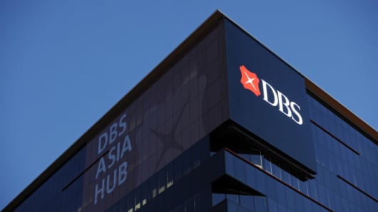 :The DBS Group Holdings Ltd. logo is displayed atop the company's DBS Asia Hub building in Singapore, on Thursday, Feb. 9, 2012.