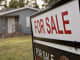 A 'For Sale' sign stands outside a home in Peoria, Illinois.