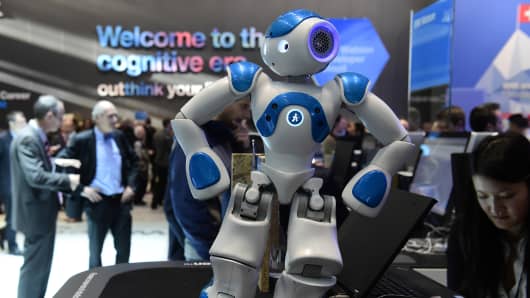 A small interactive robot from IBM's Watson AI department, shows fairgoers some moves at the Digital Business fair CEBIT in Hanover, central Germany, on March 15, 2016.