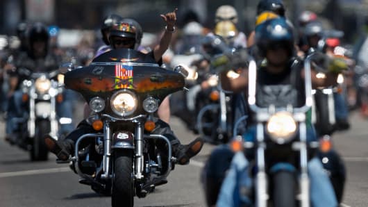 Harley Davidson bikers parade during a Harley meeting in Copacabana beach, in Rio de Janeiro.