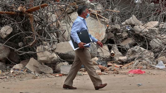 A man walks along a street of Portoviejo, Ecuador, almost a week after an earthquake hit.