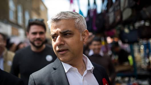 Labour's London Mayoral candidate Sadiq Khan and member of Parliament for Tooting walks through East Street Market in Walworth on May 4, 2016 in London, England.