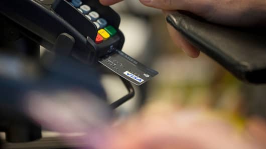 A customer enters their pin number while making a chip and pin payment using a Visa Inc. payment card, via a Verifone Systems Inc. payment device at a restaurant
