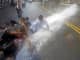 Children lying in the street cool off in the water from a fire hydrant August 1, 2006 in New York City.