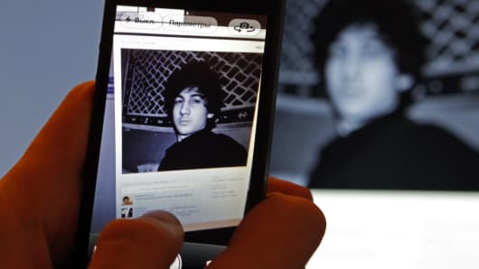 A photograph of Djohar Tsarnaev, who is believed to be Dzhokhar Tsarnaev, convicted in the Boston Marathon bombing, is seen on his page of Russian social networking site Vkontakte (VK), as pictured on a monitor and a mobile phone in St. Petersburg April 19, 2013. Tsarnaev posted links to Islamic websites and others calling for Chechen independence on what appears to be his page on the site.