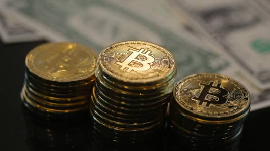 Bitcoin and Dollar notes 