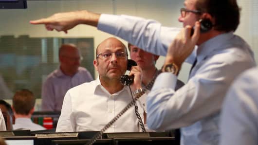 Traders from BGC, a global brokerage company in London's Canary Wharf financial centre react during trading June 24, 2016 after Britain voted to leave the European Union.