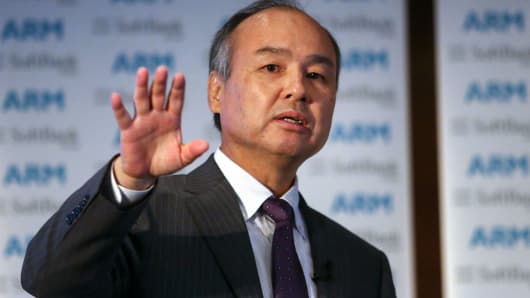 Masayoshi Son, chairman and chief executive officer of SoftBank Group Corp., gestures whilst speaking during a news conference in London, on Monday, July 18, 2016.