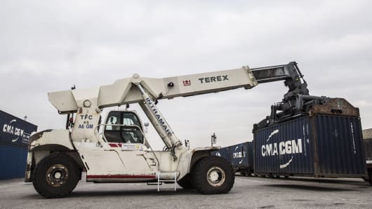 A Terex reach stacker transports a CMA CGM SA shipping container in the Med Europe Terminal at the Port of Marseille, France.