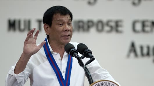 Philippine President Rodrigo Duterte gestures during a speech.