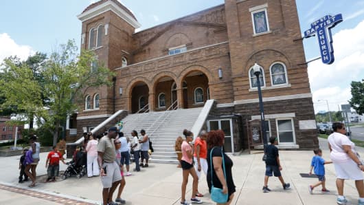 Visitors walk in front of the Sixteenth Street Baptist Church in Birmingham, Alabama.