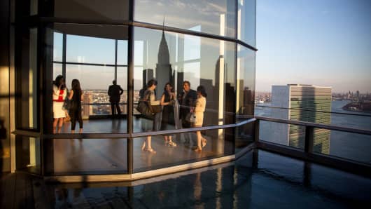 Guests attend a pool party in a penthouse apartment in New York.
