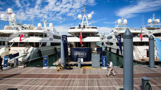 Superyachts sit moored during the Superyacht Miami boat show at Island Gardens Deep Harbour in Biscayne Bay, Miami, Florida.