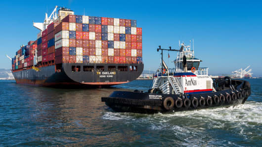 The Yang Ming Marine Transport Corp. Oakland cargo ship is guided into the Port of Oakland by an AmNav tug boat.